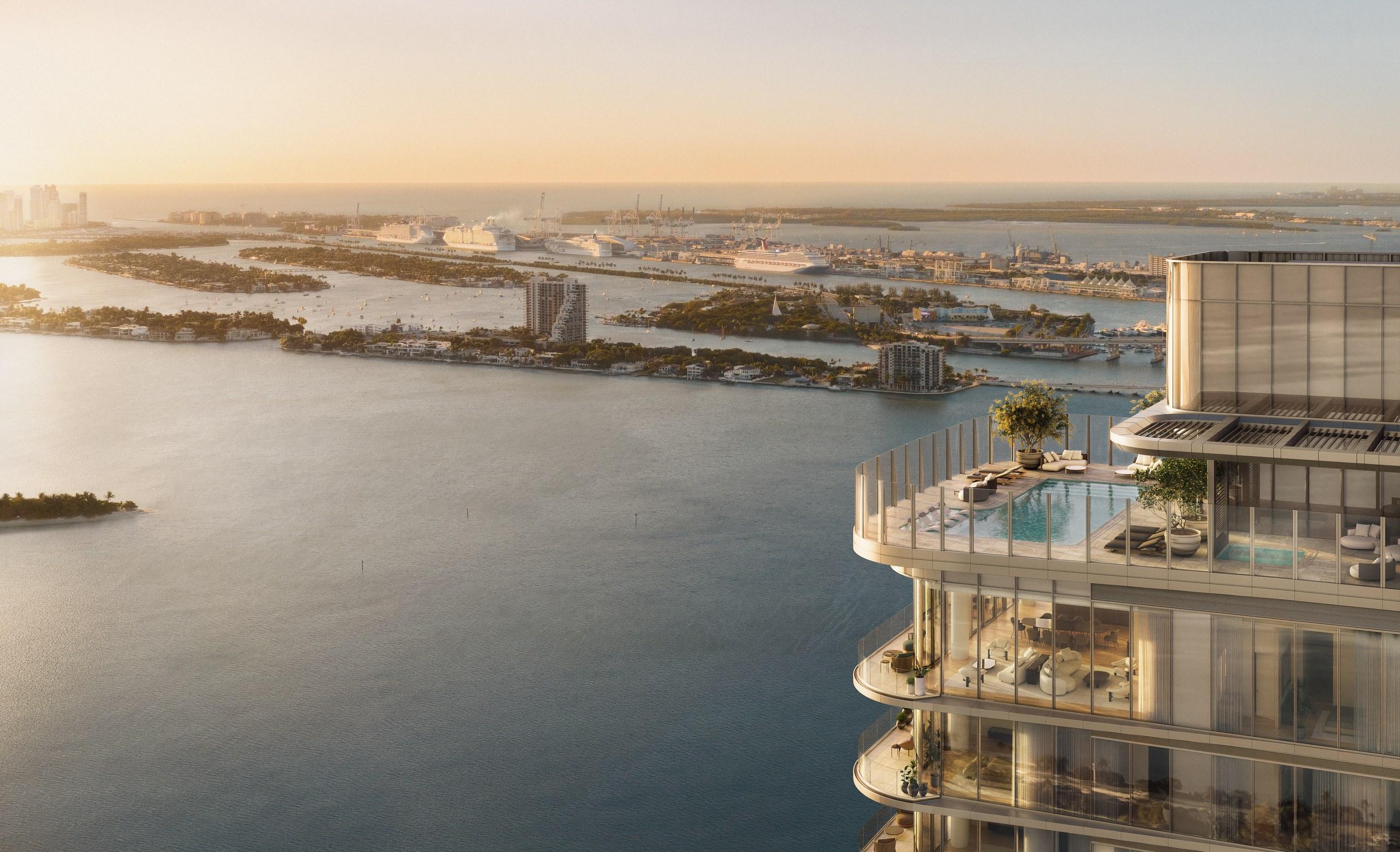 The rooftop pool deck at LiLLi Edgewater seen from above, with Biscayne Bay, the islands and PortMiami beyond
