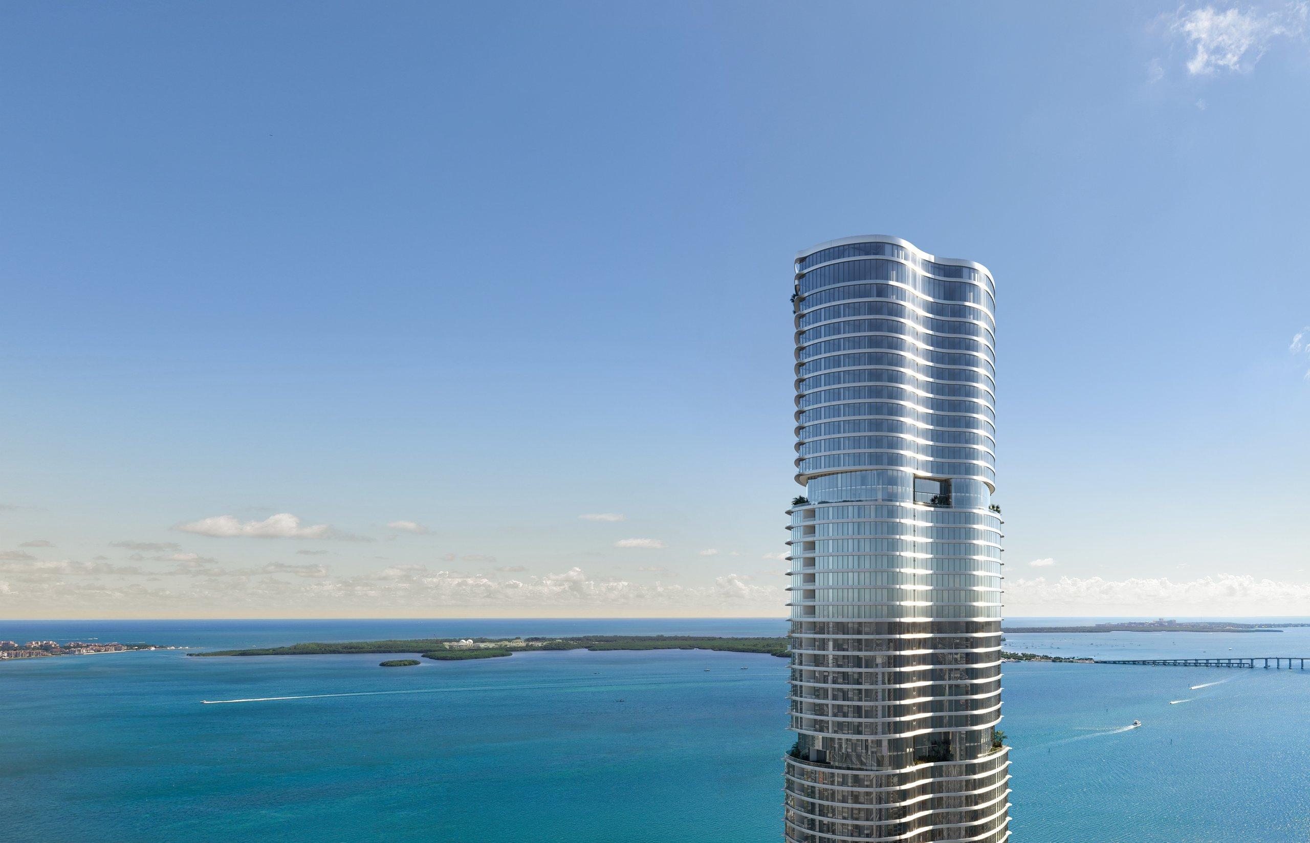 The full 619 Brickell tower of curved glass terraces rising above the Brickell waterfront