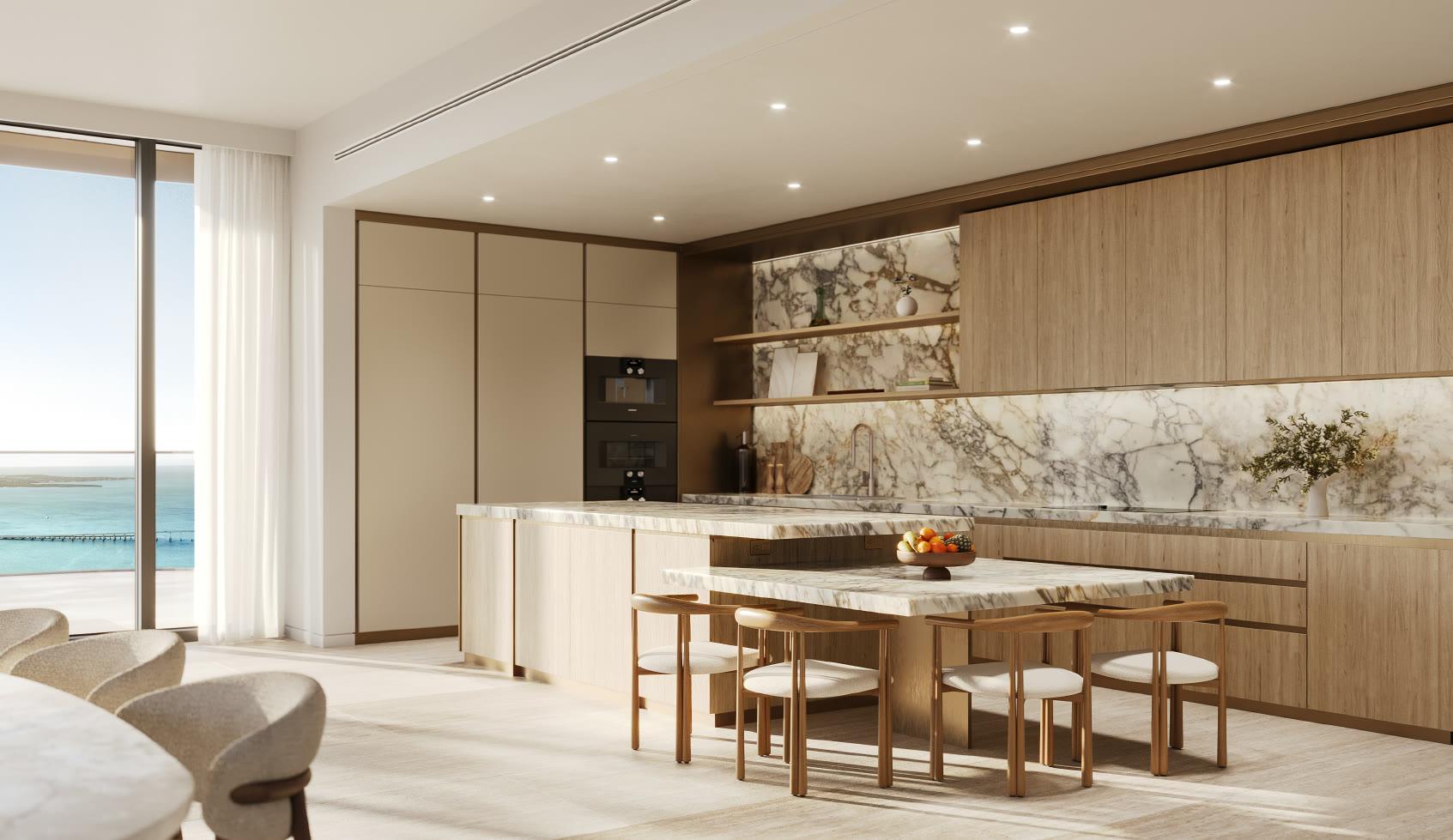 Residence kitchen with custom Italian cabinetry and stone surfaces at Mandarin Oriental Residences