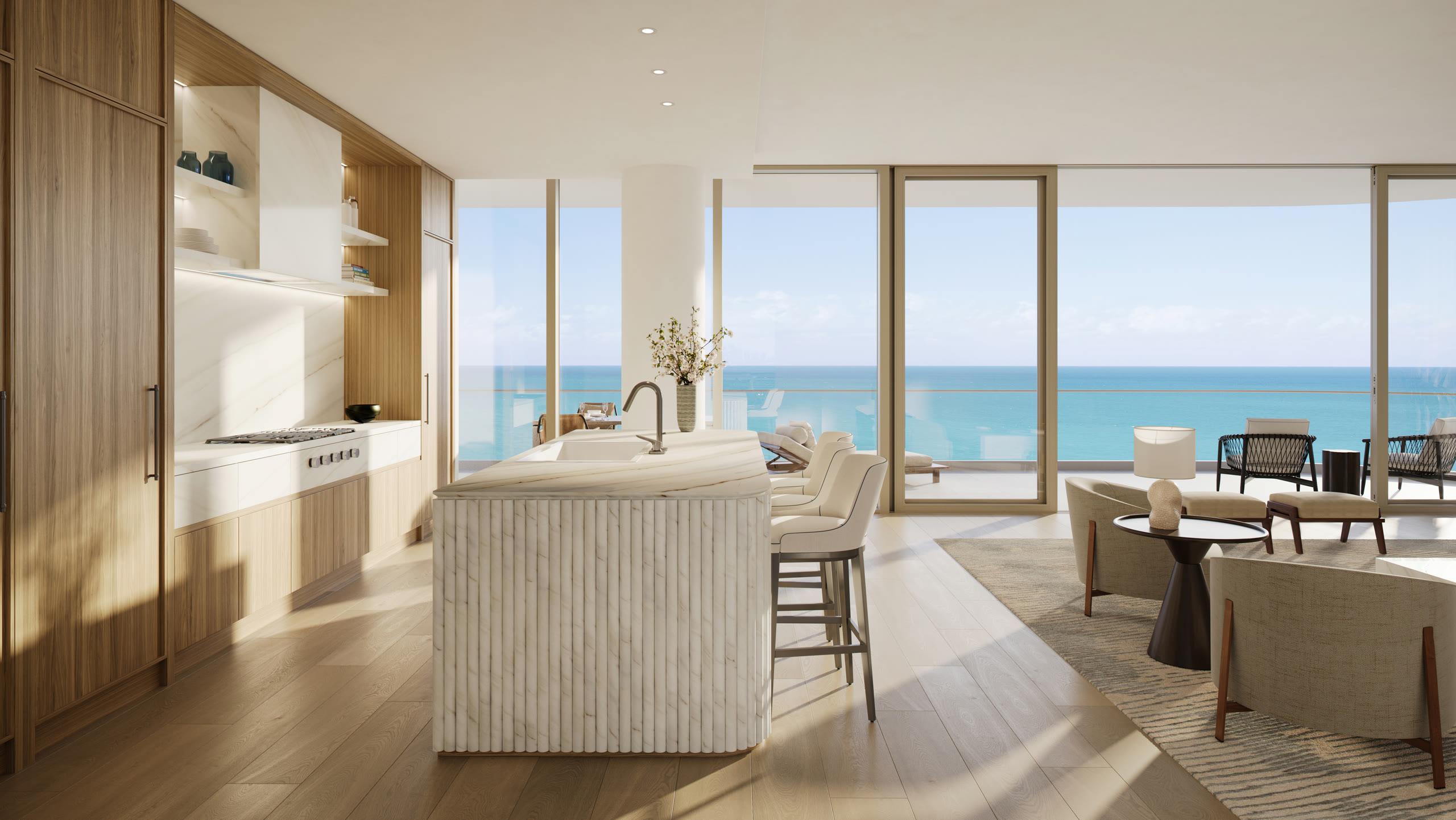 A residence kitchen with custom Italian cabinetry, honed marble island, and floor-to-ceiling windows to the Atlantic