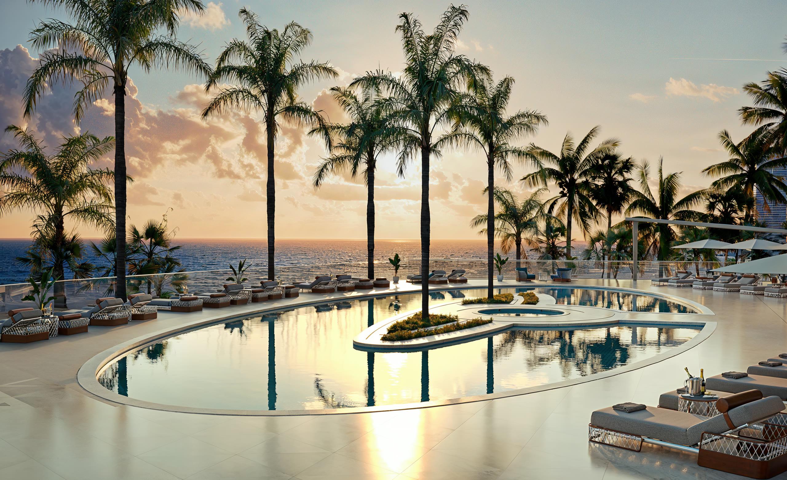 Oceanfront pool deck at Bentley Residences at sunset