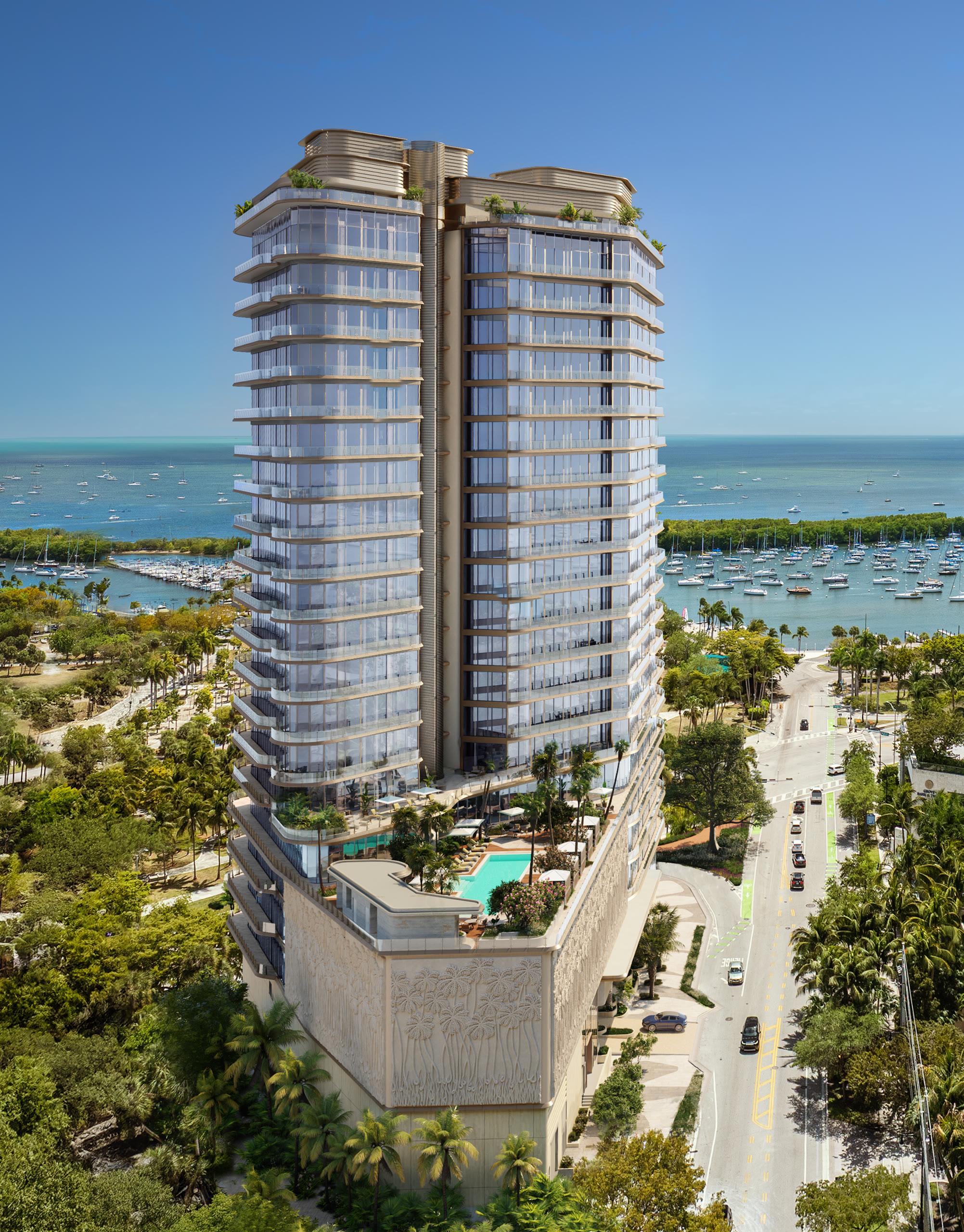 Serviced pool deck framed by palms above Biscayne Bay at Four Seasons Coconut Grove