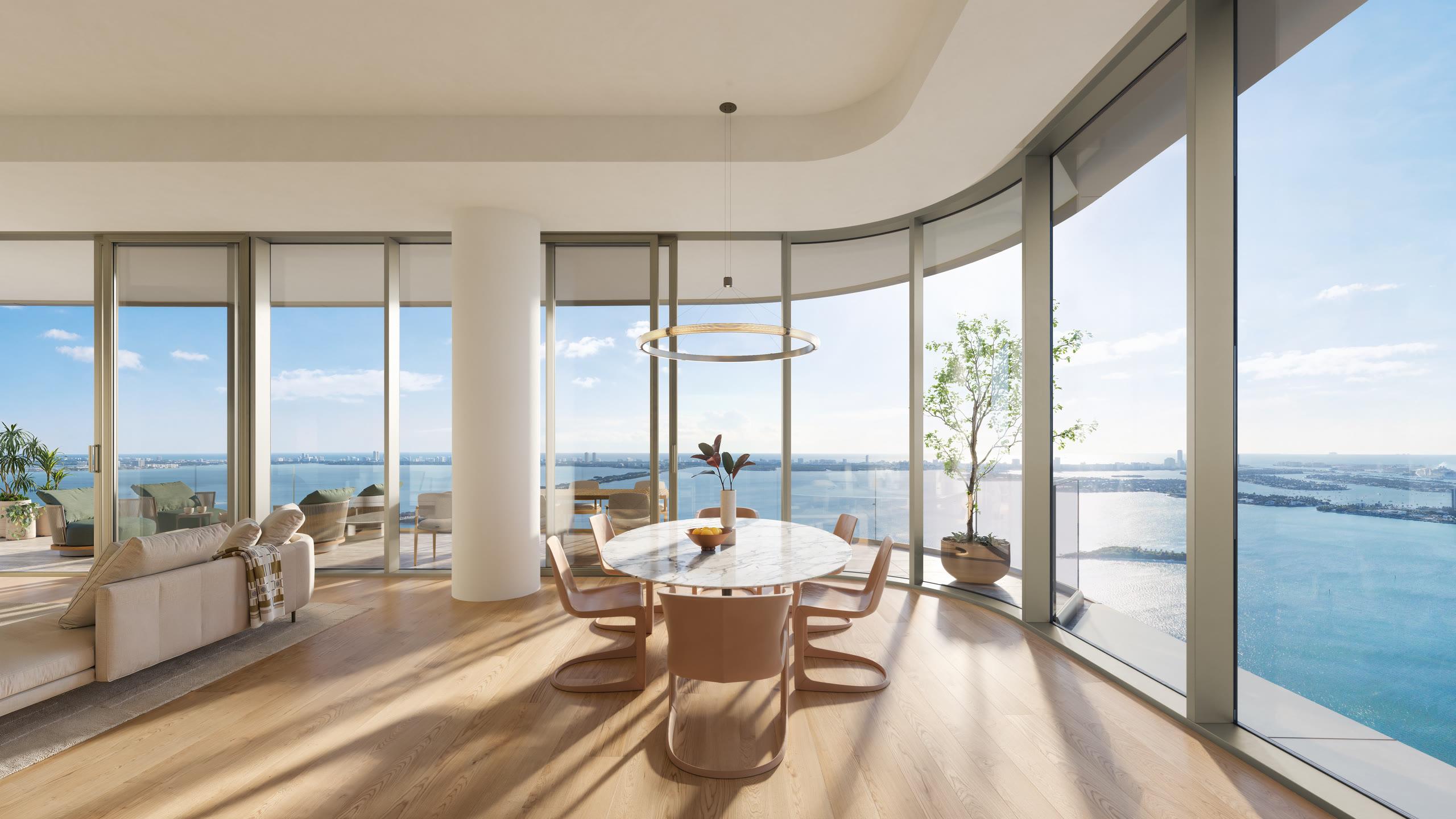 Living room at LiLLi Edgewater framed by floor-to-ceiling glass and an east-facing bay view