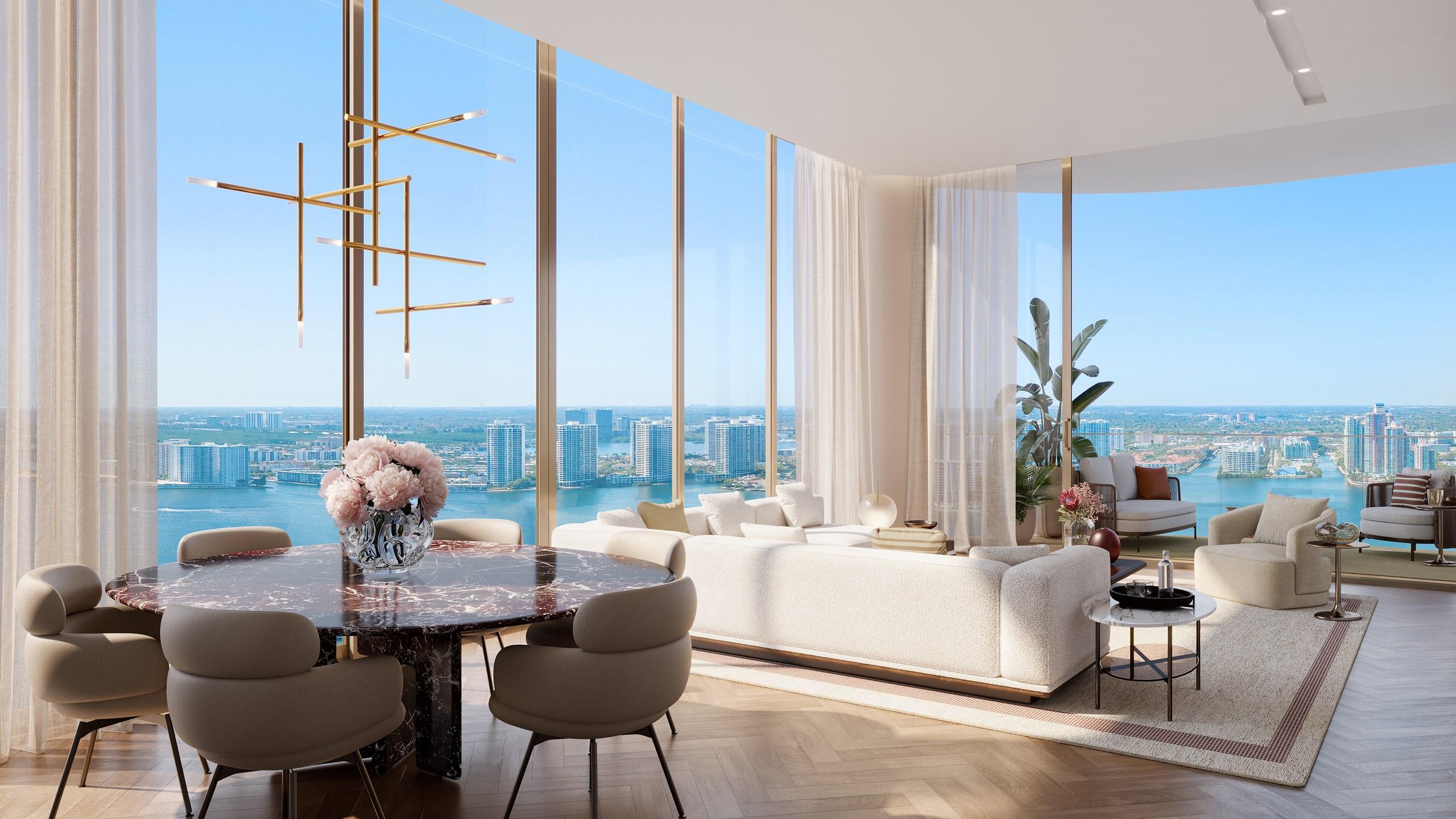Living and dining room in a St. Regis North Tower residence, framed by floor-to-ceiling glass