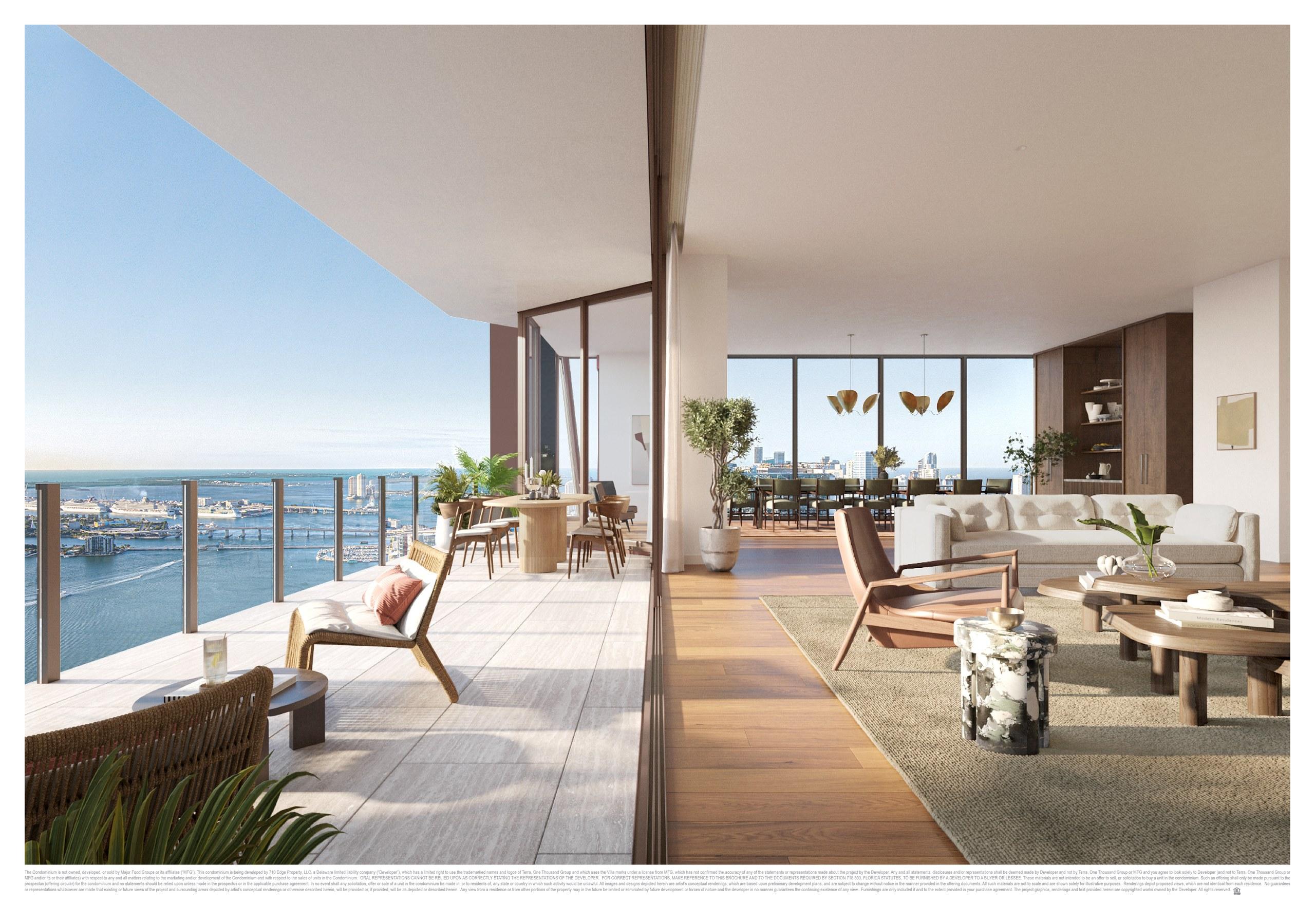 A bayfront living room opening to a terrace at Villa Miami, Edgewater